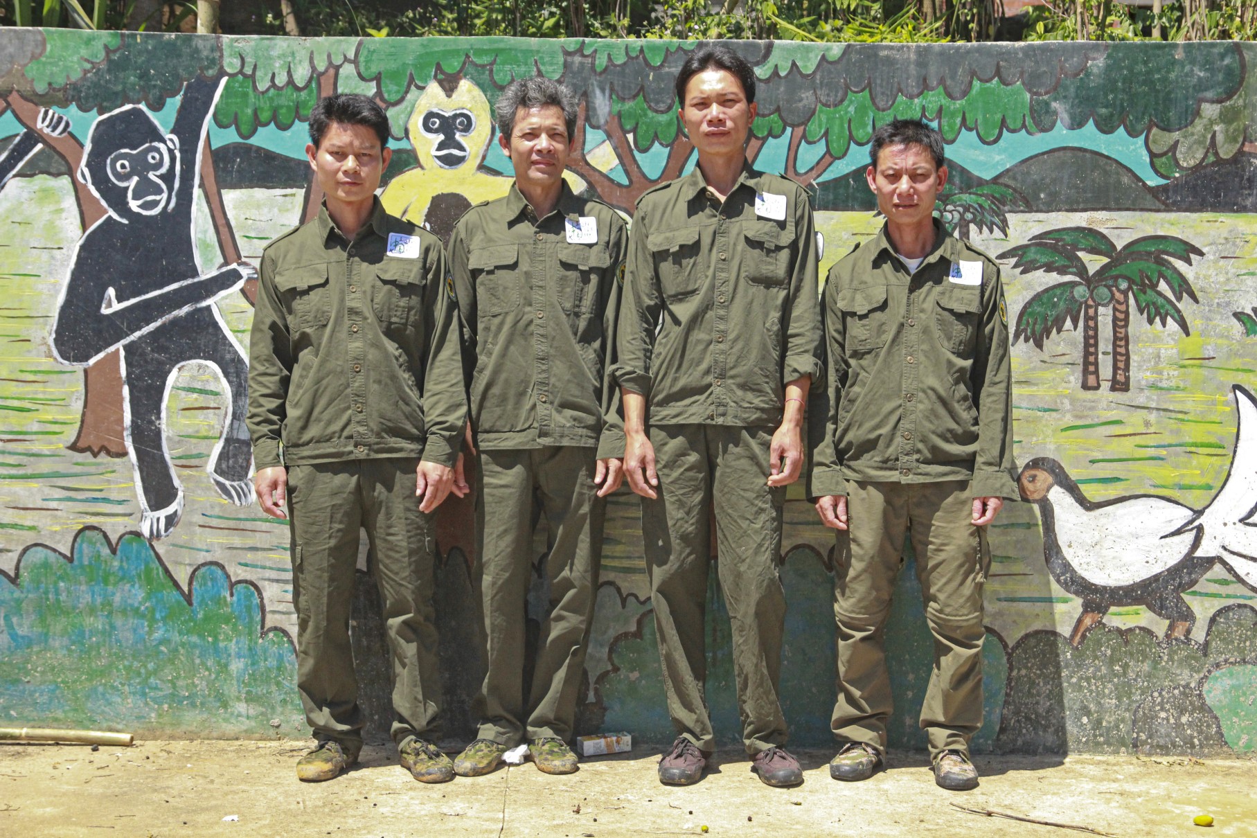 The community monitoring team (from left: Li Quanjin, Lin Qing, Zhang Zhicheng and Li Wenyong) are old friends of the Hainan Gibbon.